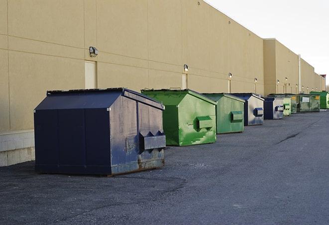 a row of yellow and blue dumpsters at a construction site in American Canyon CA